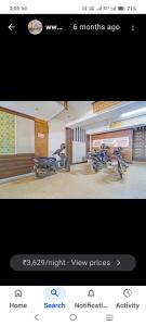 a screenshot of a picture of two motorcycles in a room at AB Merridien in Coimbatore