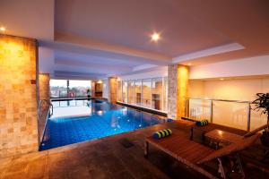 a large swimming pool in the middle of a building at PrimeBiz Tegal in Tegal