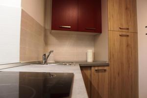a kitchen with a sink and a counter top at Maison Leveque in Brusson +4 photos