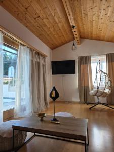 a living room with a coffee table and a couch at Glory Igls Lodge in Innsbruck