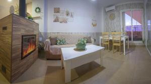 a living room with a couch and a table at El Barro Colorao in Segura de León +27 photos