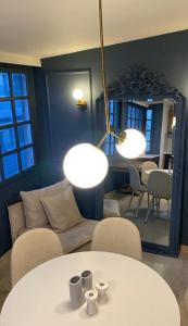 a living room with a table and a couch and a mirror at Loft 038 City Center in Heraklio +42 photos