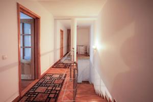 a hallway with a staircase in a house at Casa de vacanță in Călimăneşti