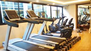 a row of cardio machines in a gym at Metro Hotel & Spa in Thung Song