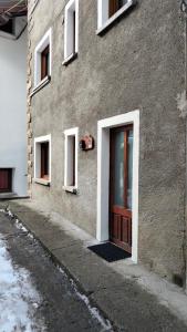a door on the side of a building at La Cloche in Valtournenche