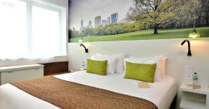 Cama ou camas em um quarto em Central Park Hôtel & Spa