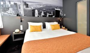 Cama ou camas em um quarto em Central Park Hôtel & Spa