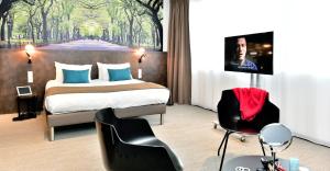 Cama ou camas em um quarto em Central Park Hôtel & Spa