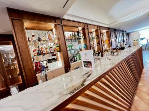 a bar with a marble counter in a room at Hotel Della Valle in Agrigento