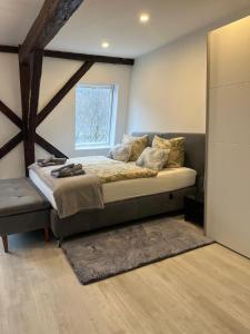 a bedroom with a large bed and a window at Riverside-Appartements in Boppard