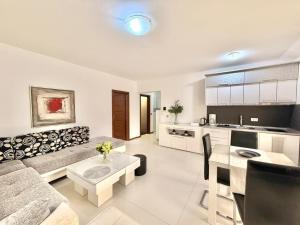 a living room with a couch and a table at Apartments Villa Stefan in Budva