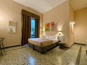 a bedroom with a bed and a large window at Lucca In Villa Elisa & Gentucca in Lucca