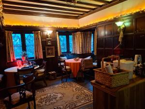 a living room with a table and a dining room at JESMOND HOUSE B&B Room3 Superking Ensuite in Hull