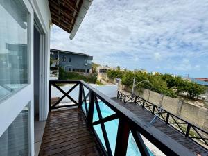 a balcony with a view of a swimming pool at Breeze Hotel in Natal