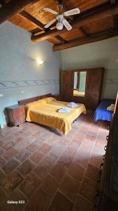 a bedroom with two beds and a ceiling at Agriturismo La.Ti.Mi.Da. in Cassine +41 photos