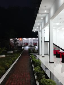 a walkway in the middle of a building at Hotel Diamond Palace in Bibile