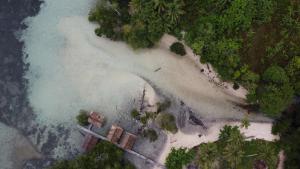 an aerial view of an island in the water at War Homestay in Pulau Minyaifuin +36 photos
