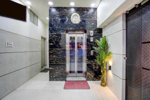a hallway with a door in a building at Hotel O ANANT ONE HOTEL AND BANQUETS in Ghaziabad