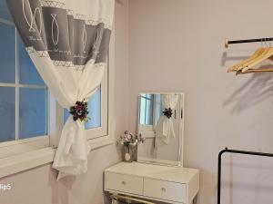 a bathroom with a dresser and a mirror at Pension Haneul Tari in Jeju +201 photos