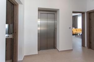 a hallway with a sliding door in a house at BlueBell Limassol Suites in Limassol