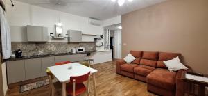 a living room with a couch and a table at Corina's Place Bologna Home in Bologna