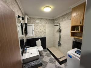 a small bathroom with a sink and a shower at Gleem Sea View 8 in Alexandria +29 photos