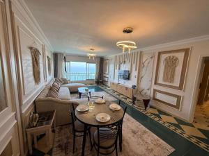 a living room with a couch and a table at Gleem Sea View 8 in Alexandria