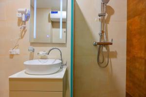 a bathroom with a sink and a shower at Panoramic Sea Apartment in Kvariati +32 photos