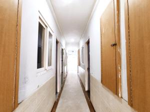 a corridor of an empty room with at TIP TOP PG - Paying Guest in Phagwāra +3 photos