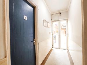 an open door in a room with a hallway at TIP TOP PG - Paying Guest in Phagwāra