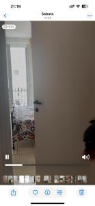 a door in a room with a bed in a room at Governo Provvisorio House in Milan