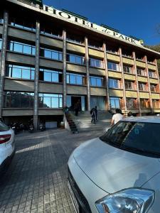 a car parked in front of a building at Hotel De Park in Shimla