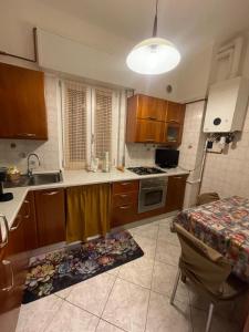 a kitchen with a floor mat in the middle of it at La Vanitas in Cremona +4 photos