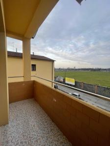 a balcony with a view of a field at La Vanitas in Cremona