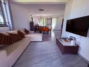 a living room with a couch and a table at Cool Breeze Villa No 2 in Grand-Baie