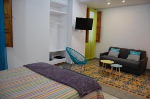 TV a/nebo společenská místnost v ubytování Eco-Friendly Apartments