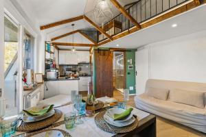a living room with a couch and a table at La Chicchetta - Happy Rentals in Sauze d'Oulx