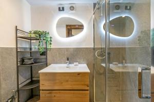 a bathroom with a sink and a shower at La Chicchetta - Happy Rentals in Sauze d'Oulx +15 photos