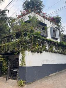 a building with plants on the side of it at Chaithritha Ladies Homestay in Trivandrum