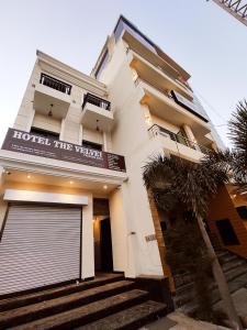 a hotel the vaterandan building with a garage at HOTEL THE VELVET PRIME - Premium & Luxury Suits Rooms in Phagwāra