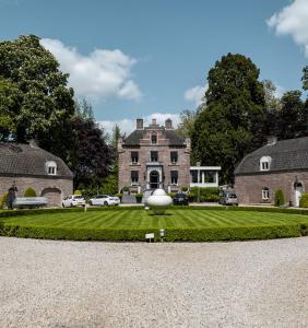 a large house with a large ball on the lawn at Kasteeltje Hattem in Roermond