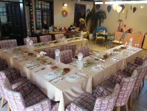 a long table in a room with chairs at Loost Town Inn Hotel in Antalya