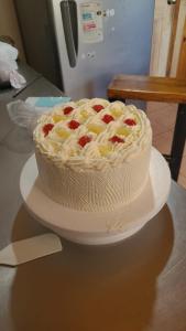a cake sitting on a plate on a table at Cafeteria y cabañas Eluney - Koigue in Pucón +48 photos