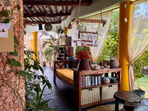 a room with a bed and a book shelf at Hera Hostel Diani in Diani Beach