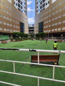 a park with a bench on a soccer field at Studio in Ajman in Ajman 