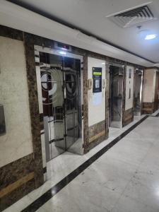 a row of elevator doors in a subway station at Studio in Ajman in Ajman 