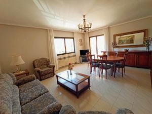 a living room with a couch and a table at Casa Patrick in Beceite +9 photos
