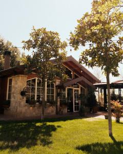 a house with trees in front of it at Bianca Hotel & Villa Tirana in Tirana