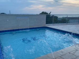 a swimming pool with water coming out of it at Sky view hotel tolu in Tolú +33 photos