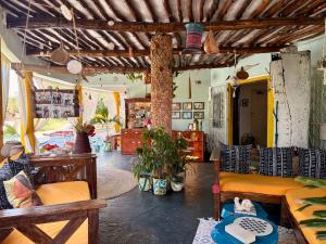a living room with a couch and a table at Casa Hera Diani in Diani Beach